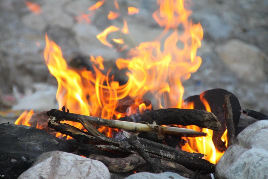 Burning campfire on the rocks